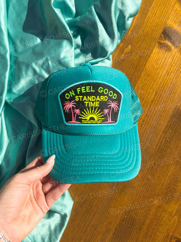 on feel good standard time teal trucker hat