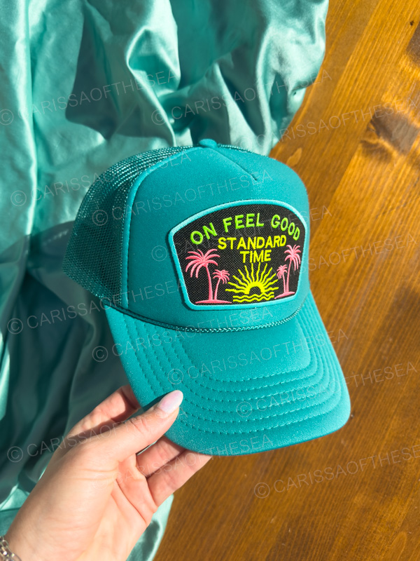 on feel good standard time teal trucker hat